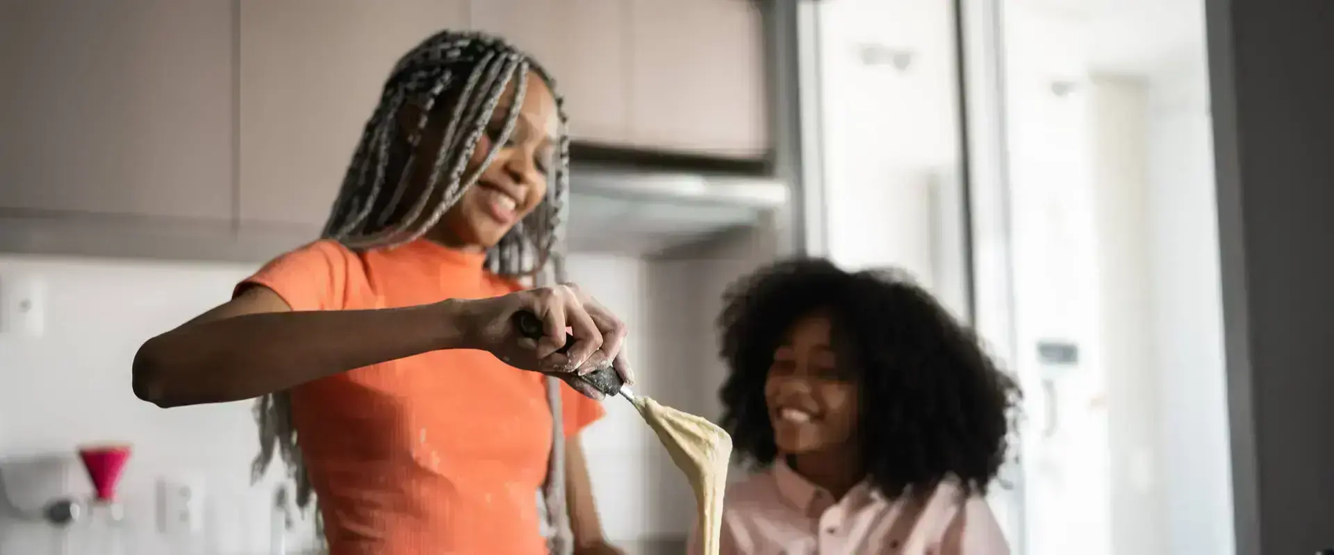 Mother and daughter baking
