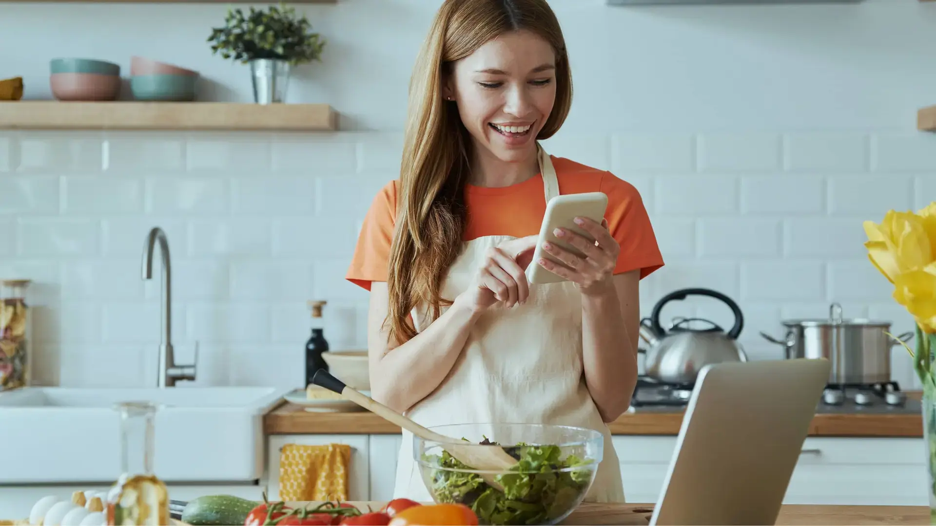 female in kitchen searching for recipes