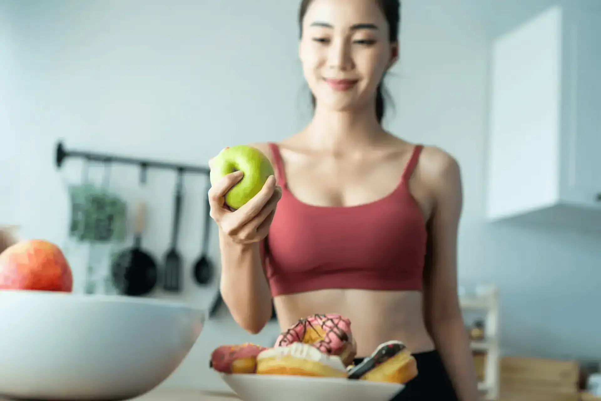 A woman holding an apple