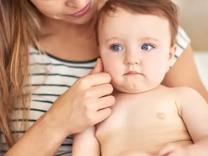 mother holding baby
