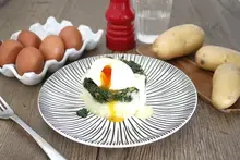 Oeufs mollets fondue d'épinards sauce beurre blanc